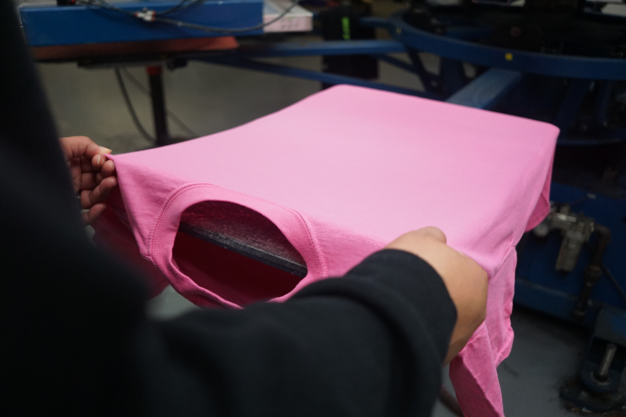 Loading T Shirt on Screen Printer